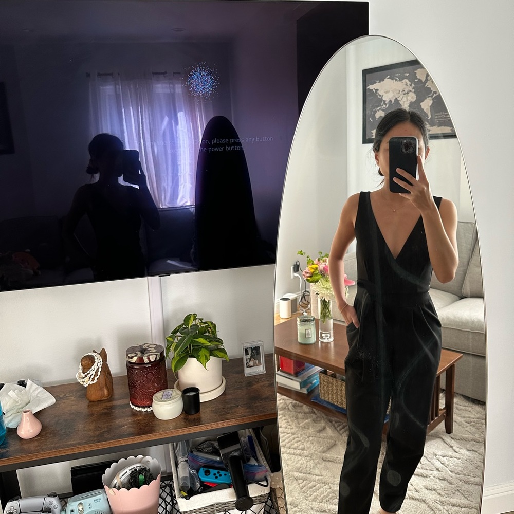 Black jumpsuit with low v cut. Has pockets!! Perfect for dinner dates